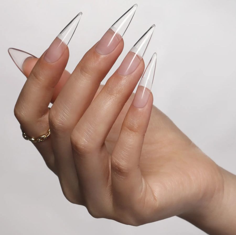 Long clear stiletto Gel-X extensions over a natural nude base
